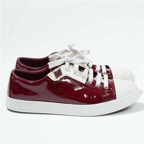 burgundy patent leather Prada sneakers